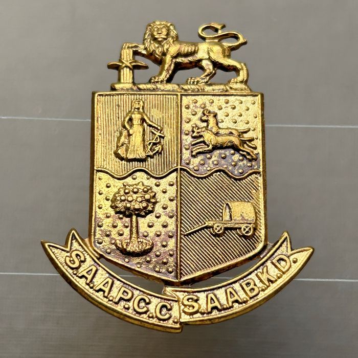 South African SA Army Pay and Clerical Corps cap badge lugs